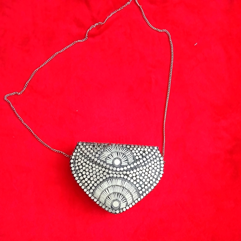 It is a beautiful silver wallet, ideal for any style of clothing.